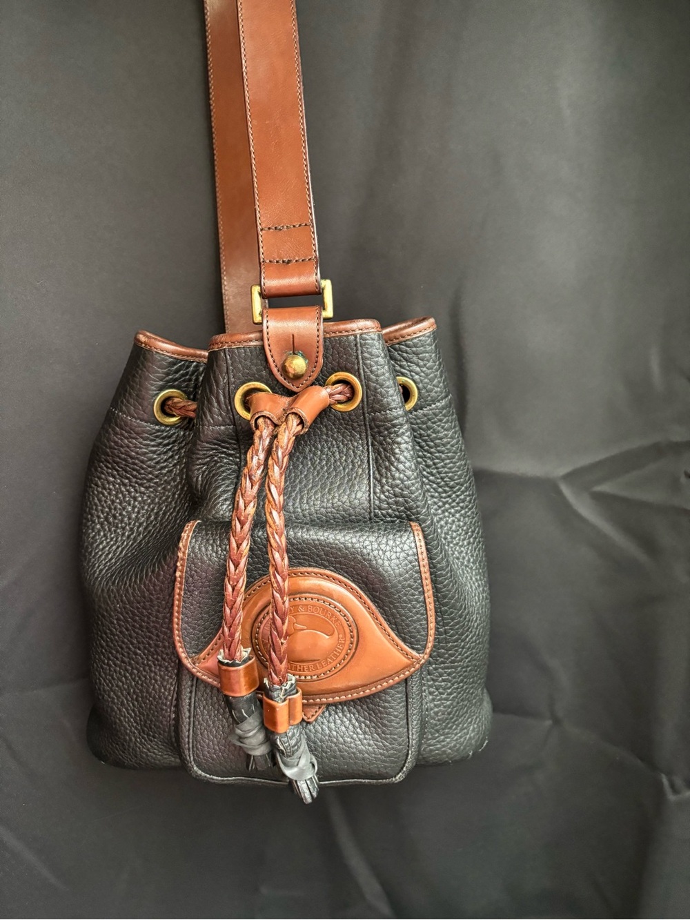 Dooney & Bourke Black Pebbled Leather Bucket Bag with Brown Trim